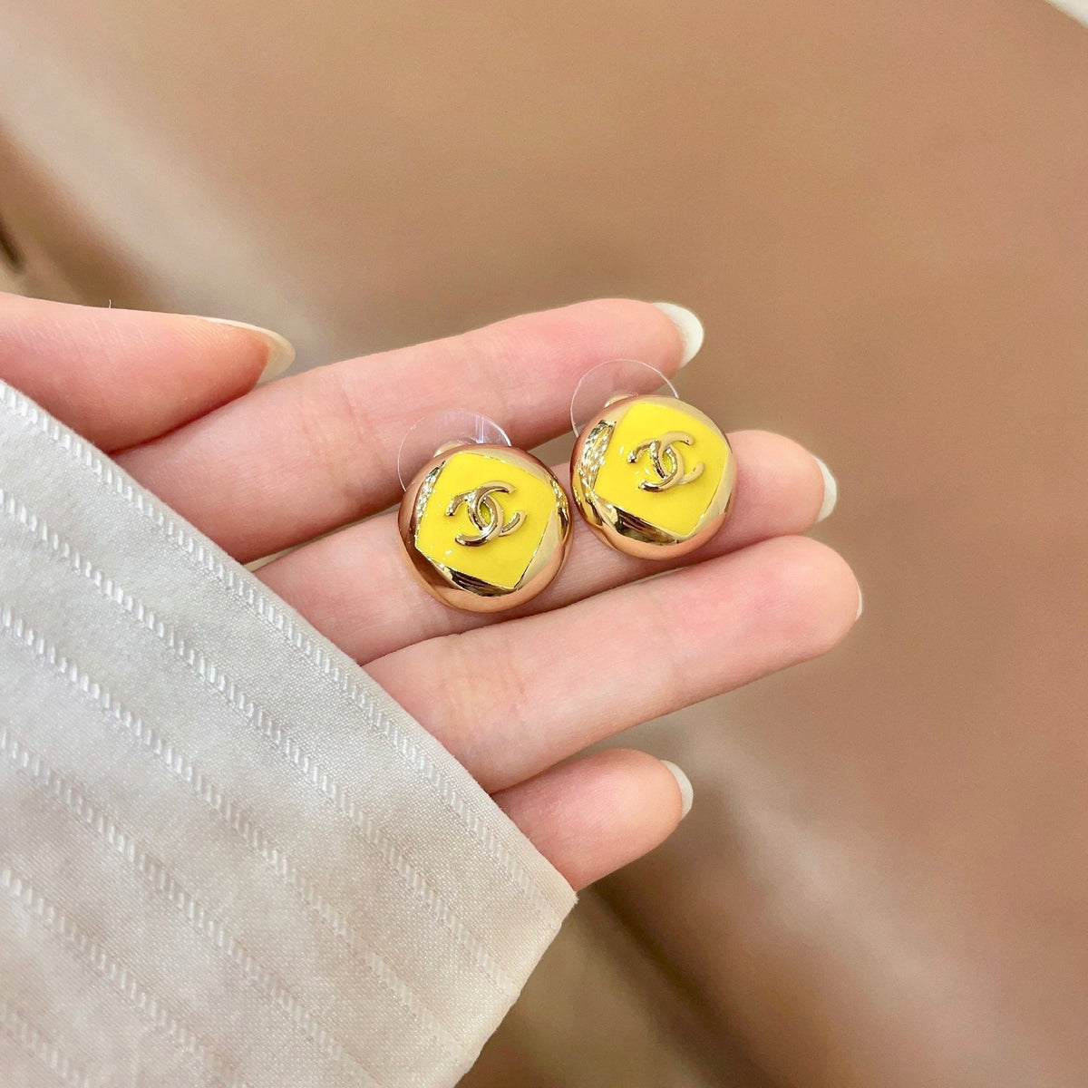 Martin Graham stud earrings in polished metal-tone – side detail