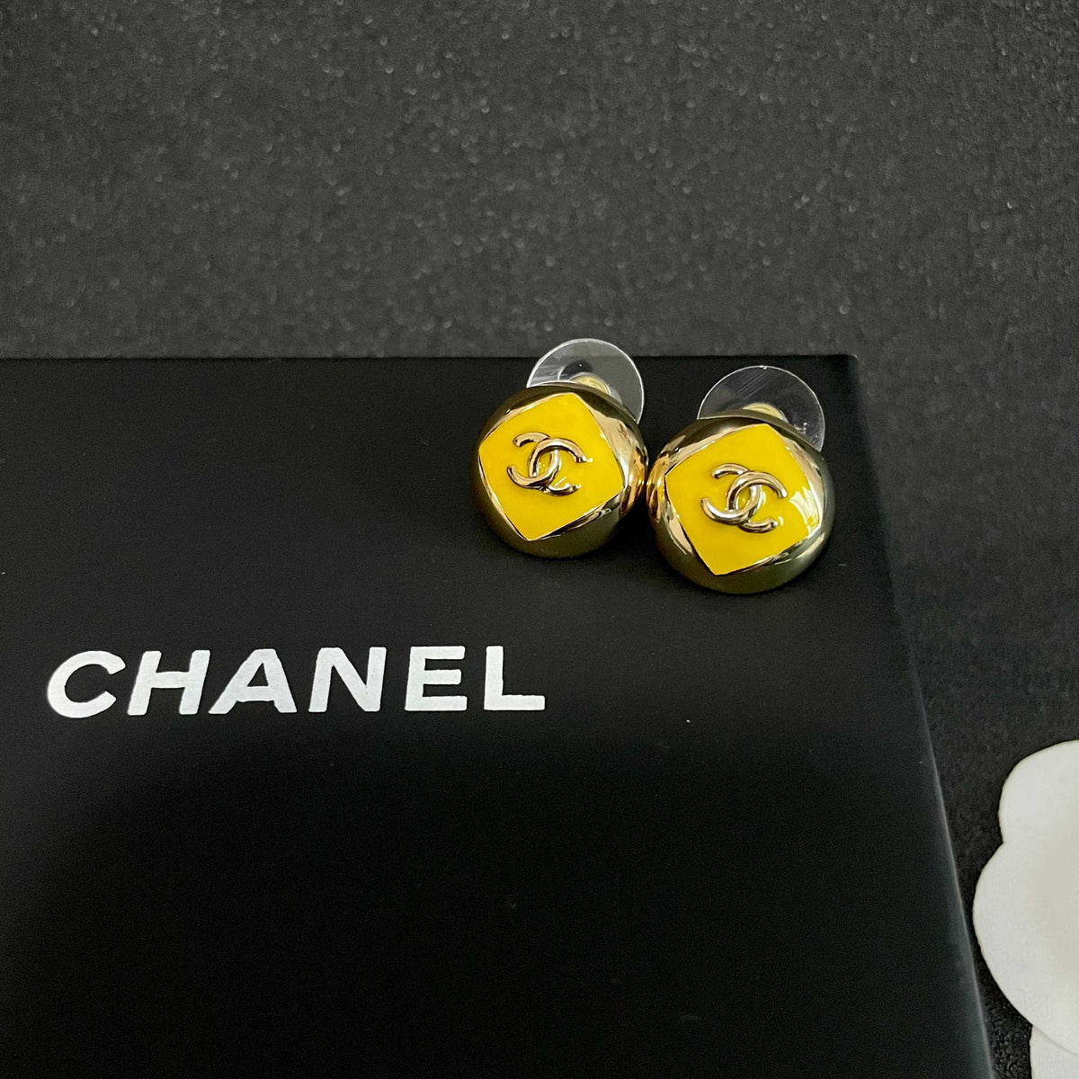 Martin Graham stud earrings in polished metal-tone – detail view