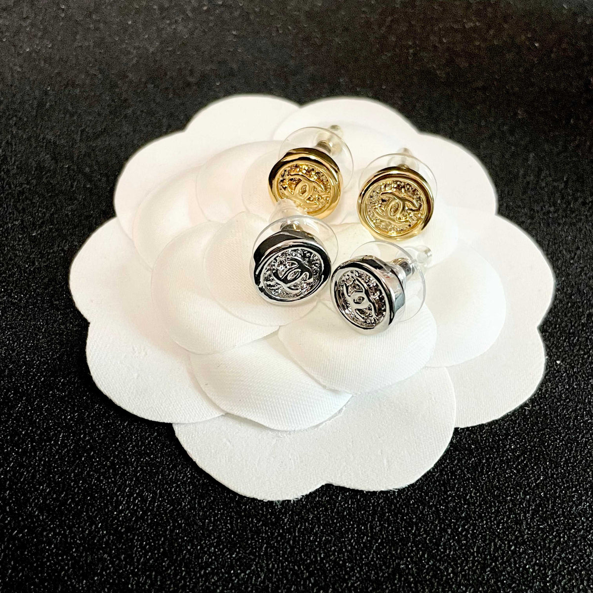 Martin Graham stud earrings in polished metal-tone – detail view