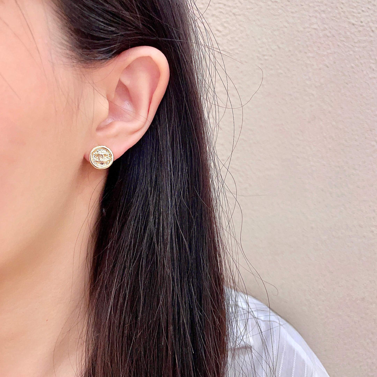 Martin Graham stud earrings in polished metal-tone – detail view