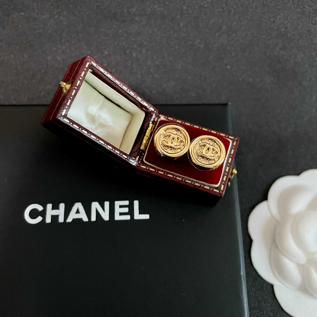 Martin Graham stud earrings in polished metal-tone – front product view