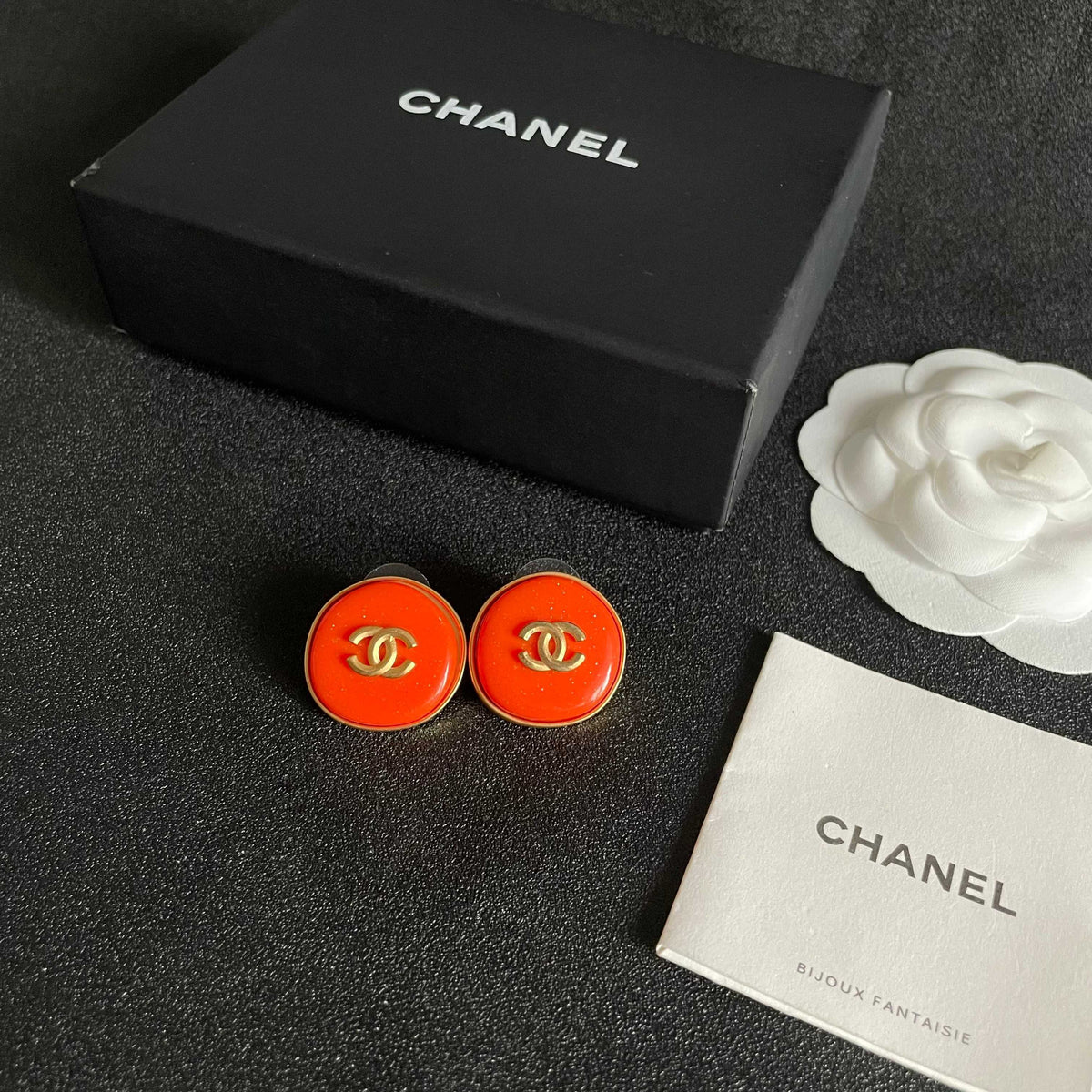 Martin Graham stud earrings in polished metal-tone – close-up detail