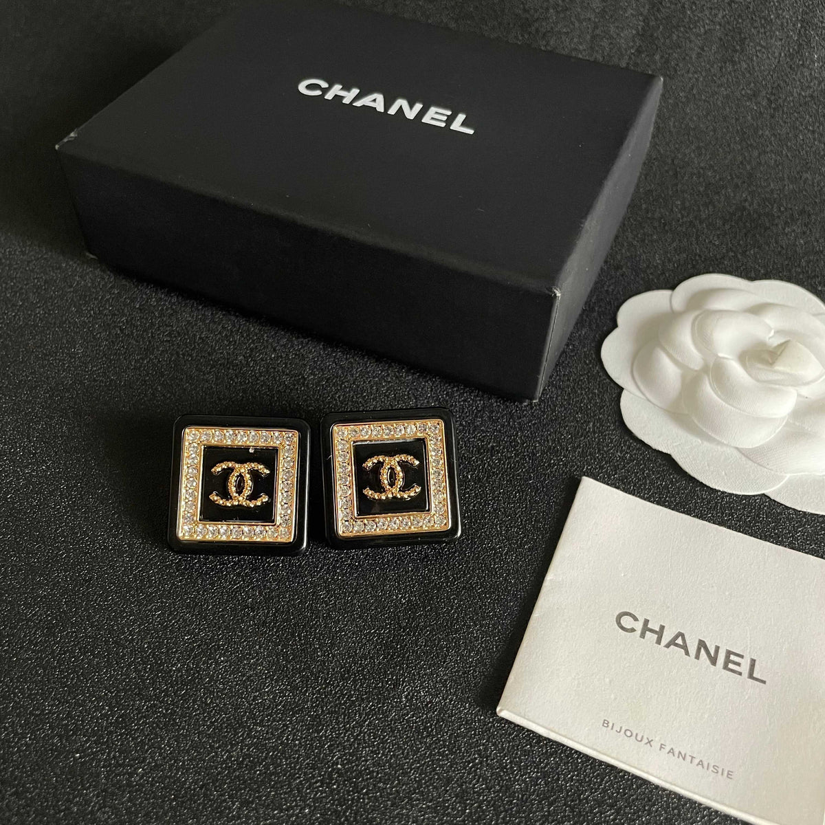 Martin Graham stud earrings in polished metal-tone – close-up detail