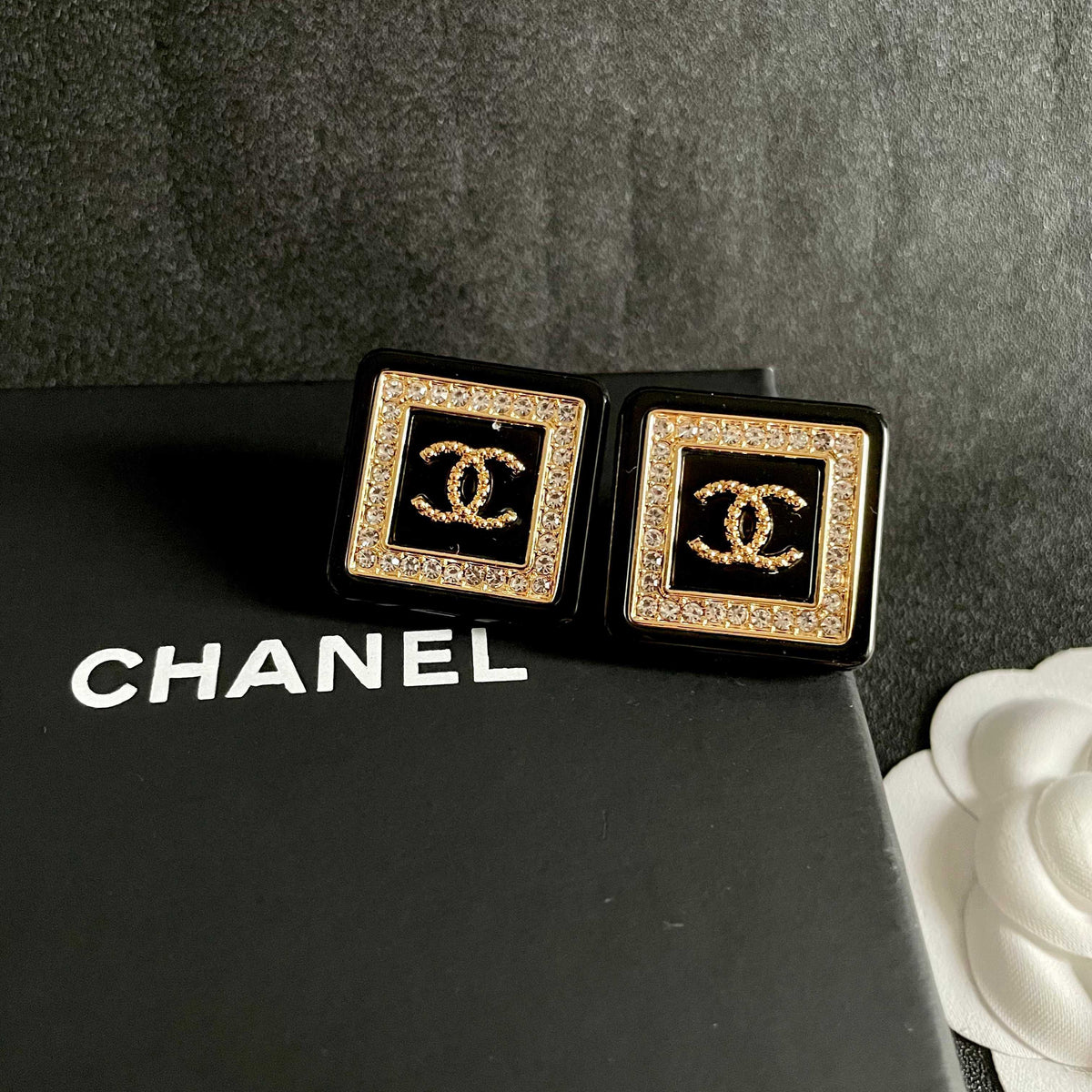 Martin Graham stud earrings in polished metal-tone – detail view