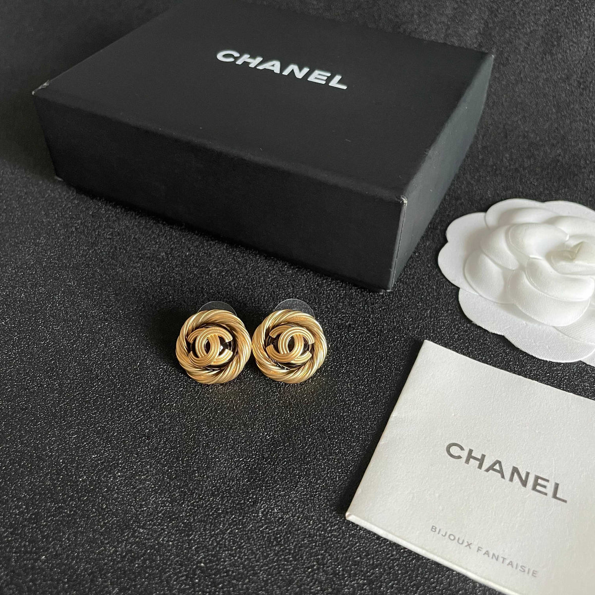 Martin Graham stud earrings in polished metal-tone – close-up detail