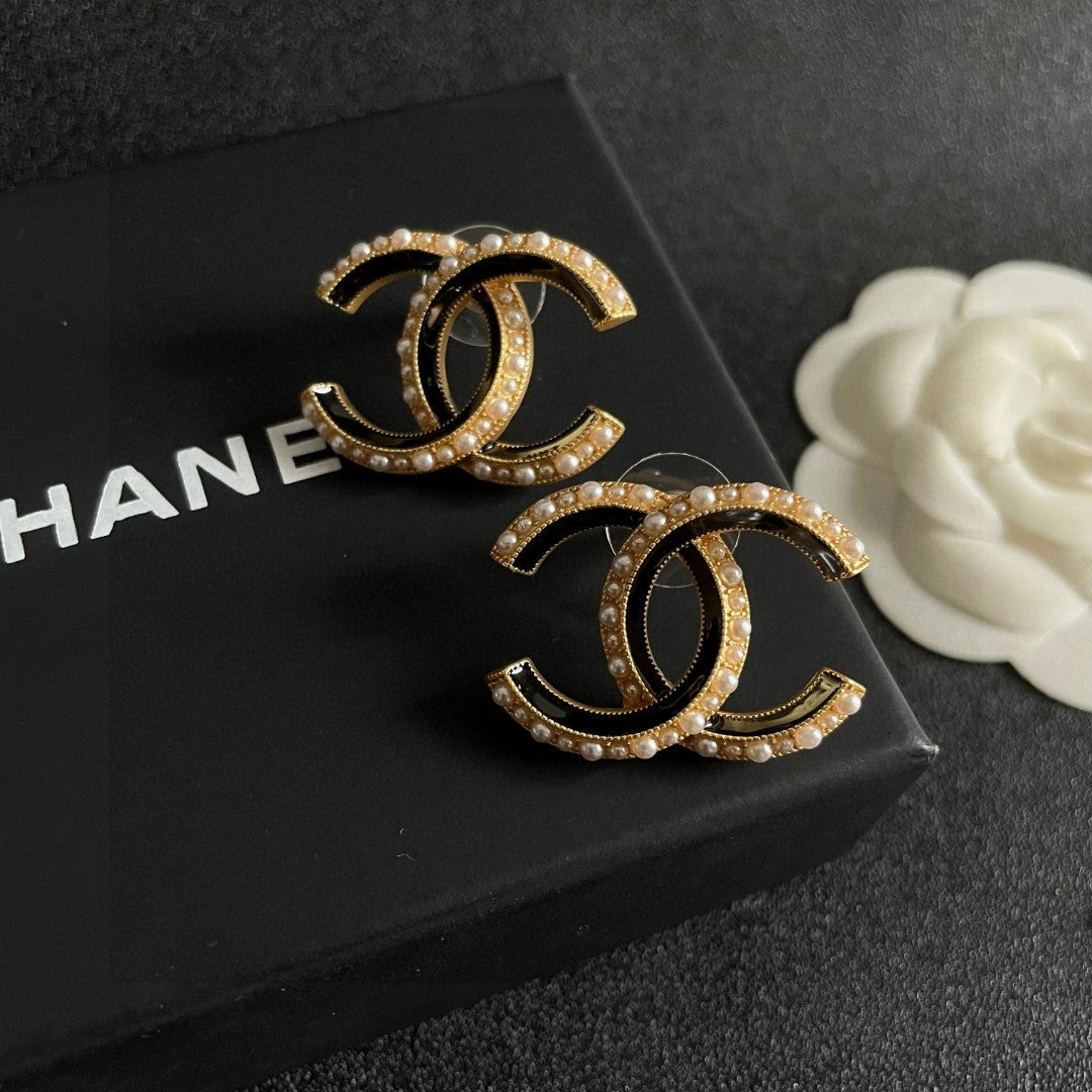 Martin Graham stud earrings in polished metal-tone – detail view