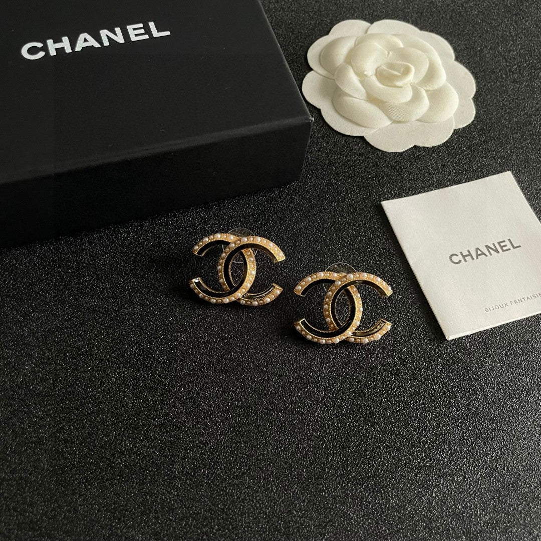Martin Graham stud earrings in polished metal-tone – styled product view
