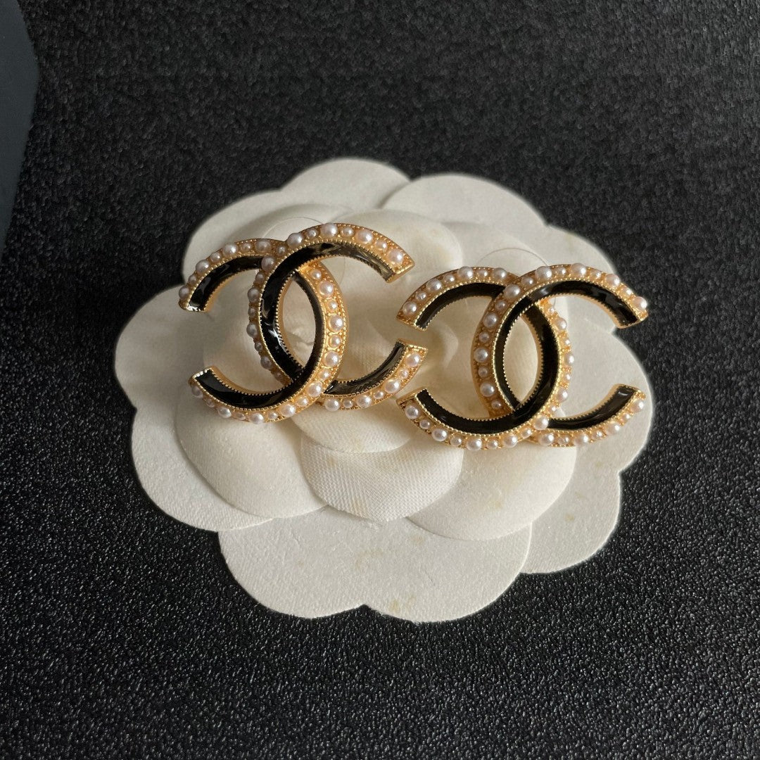 Martin Graham stud earrings in polished metal-tone – front product view