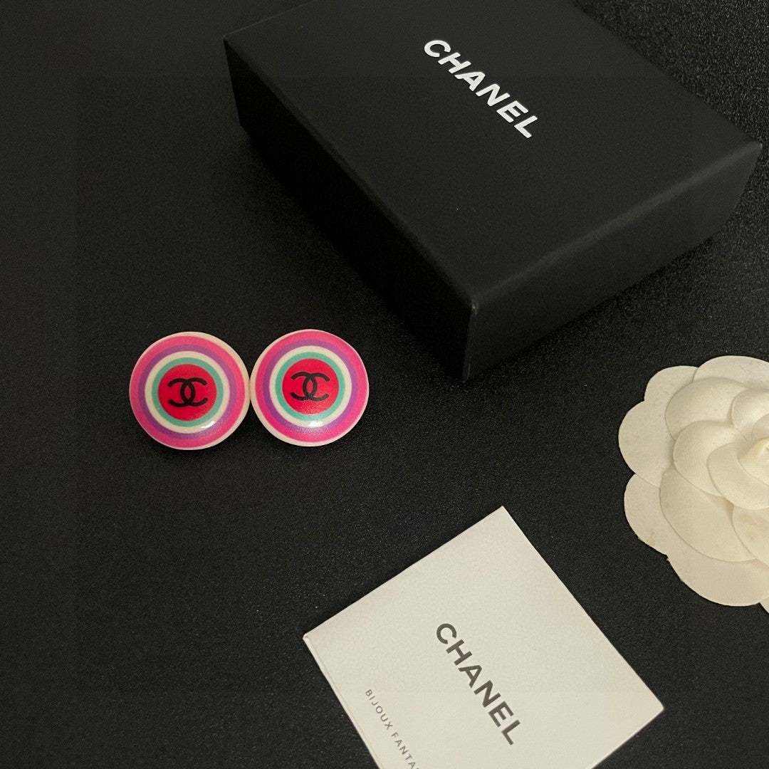 Martin Graham stud earrings in polished metal-tone – close-up detail