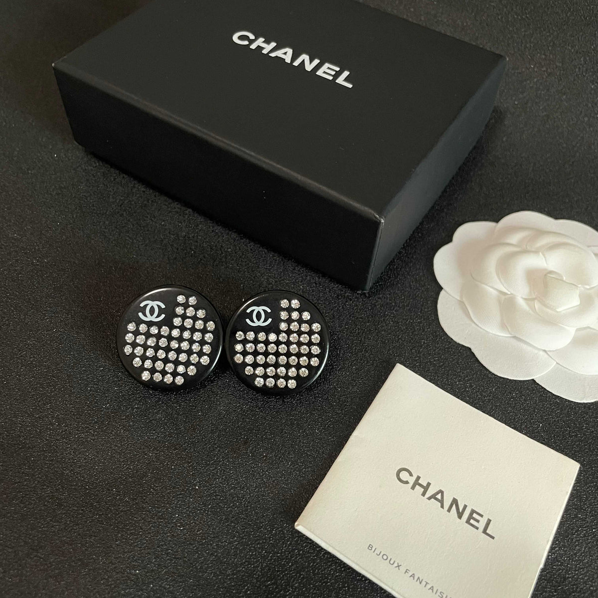 Martin Graham stud earrings in polished metal-tone – close-up detail
