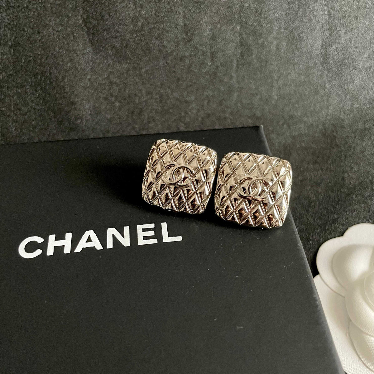 Martin Graham stud earrings in polished metal-tone – detail view
