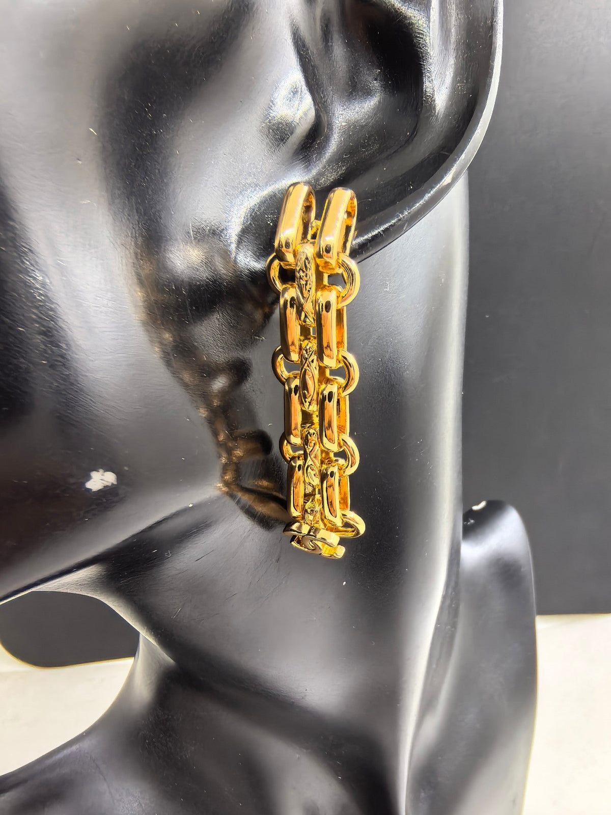 Martin Graham earrings in polished metal-tone – front product view