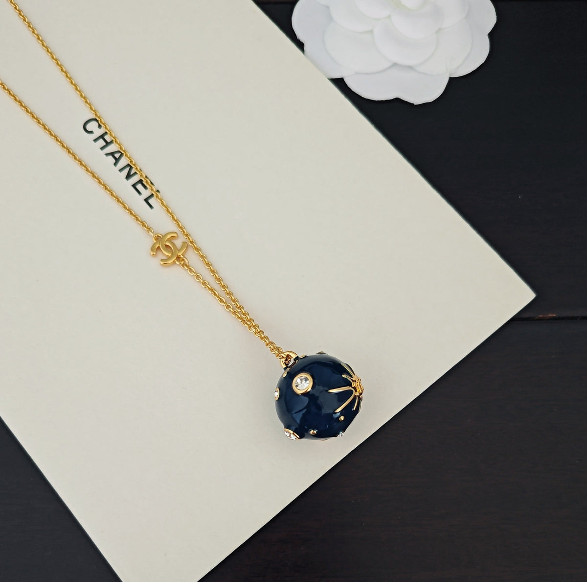 Martin Graham pendant necklace in polished metal-tone – detail view