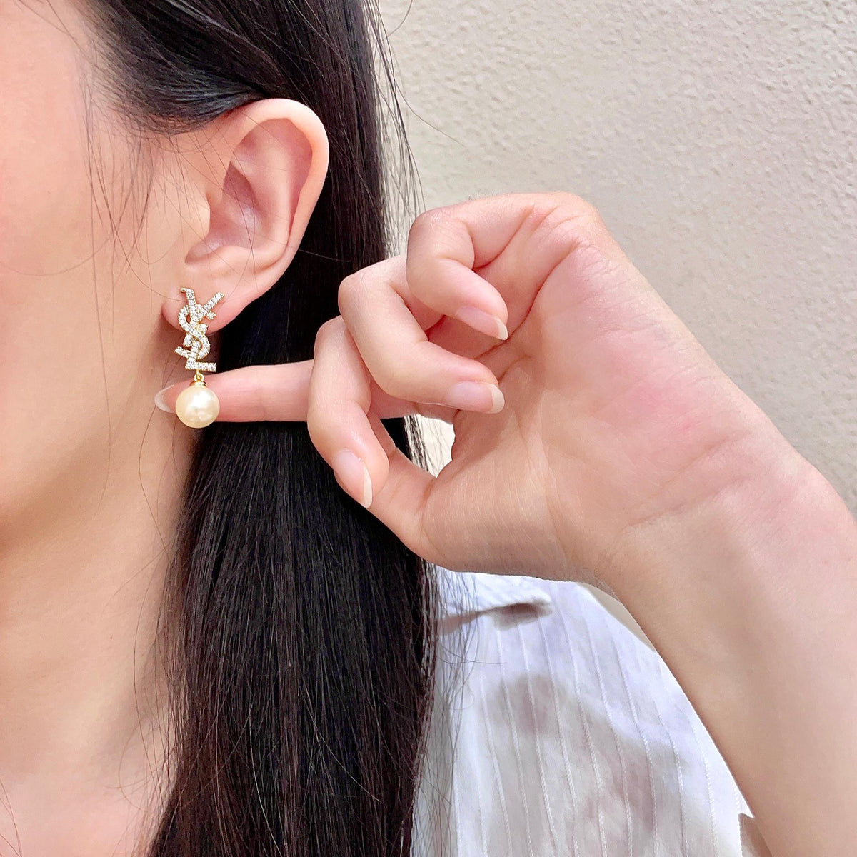 Martin Graham stud earrings in polished metal-tone – front product view