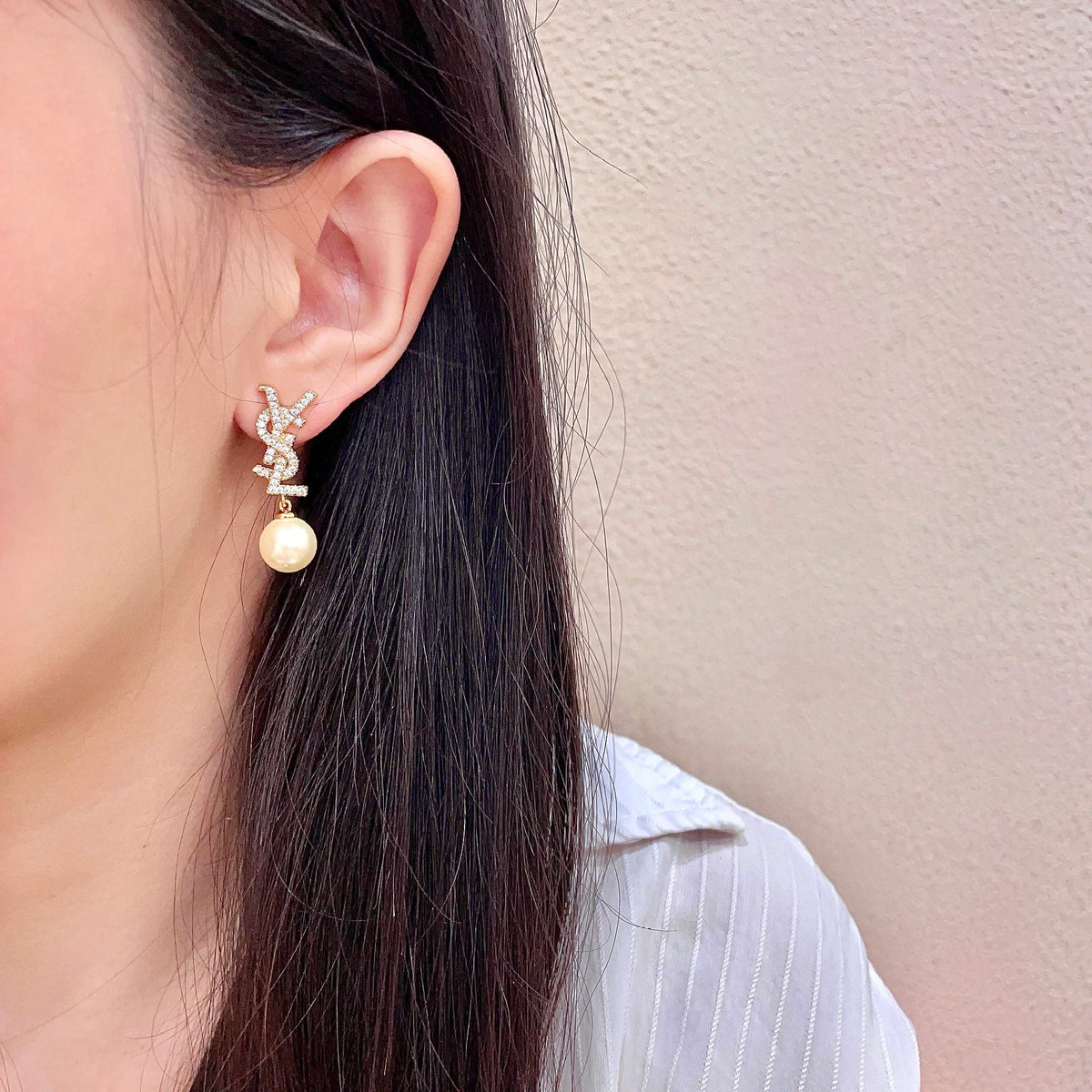 Martin Graham stud earrings in polished metal-tone – detail view