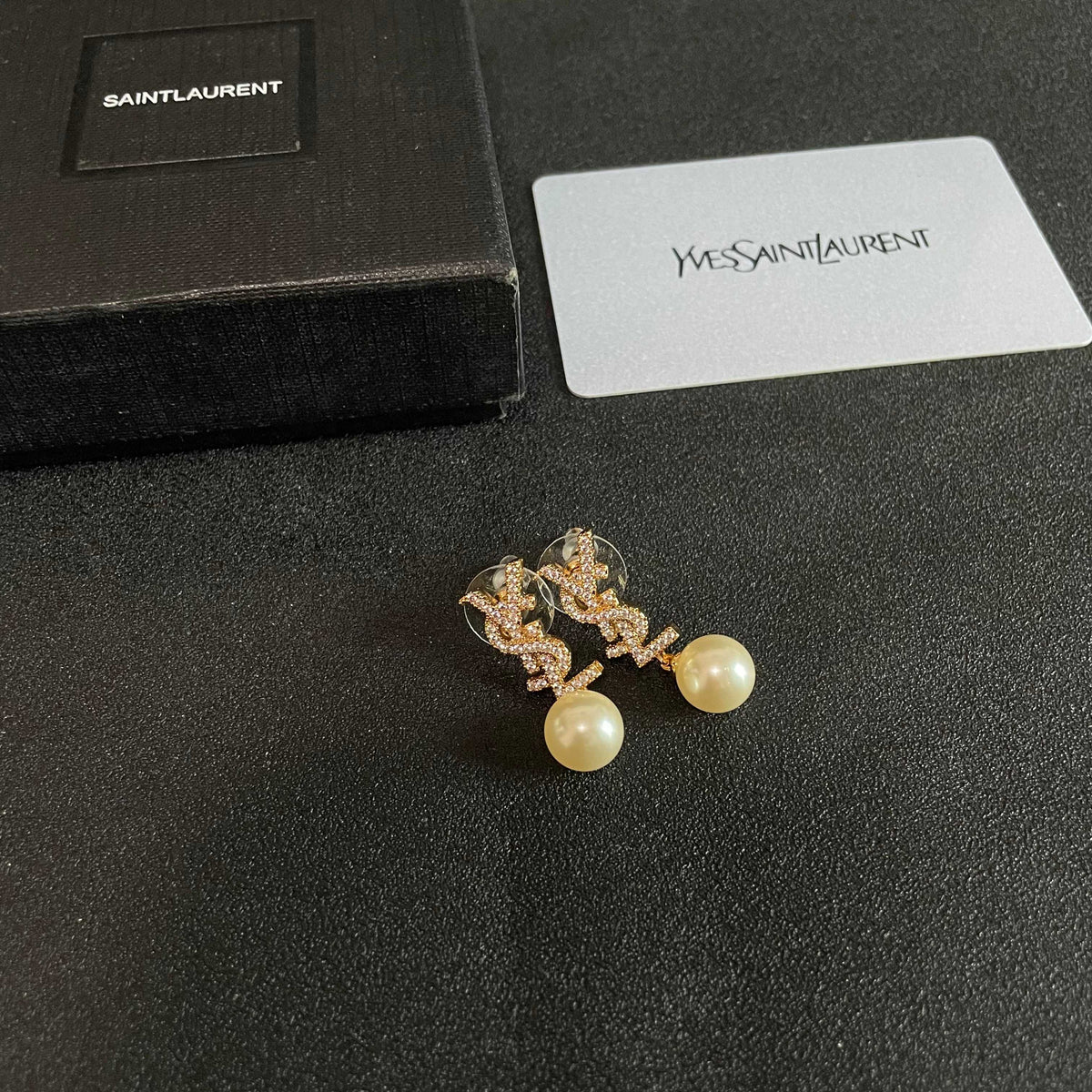 Martin Graham stud earrings in polished metal-tone – styled product view