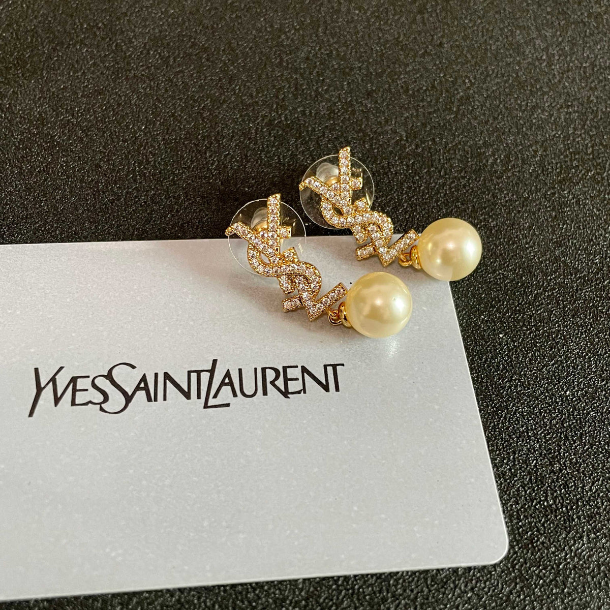 Martin Graham stud earrings in polished metal-tone – front product view