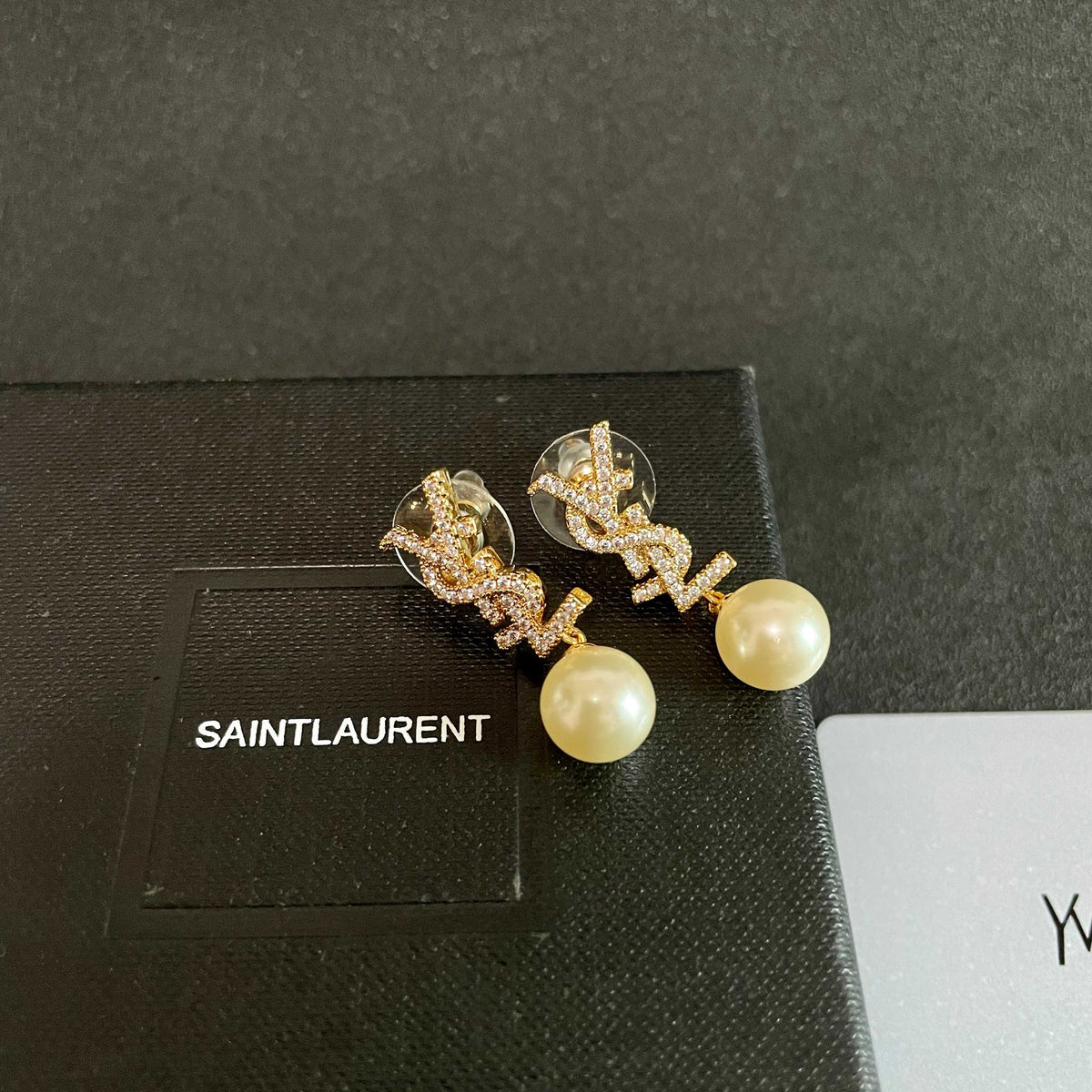 Martin Graham stud earrings in polished metal-tone – detail view