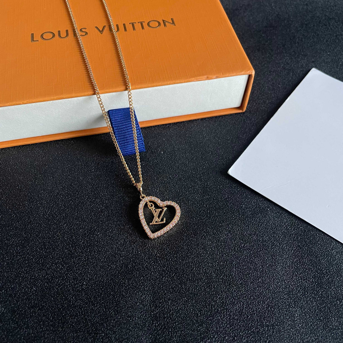 Martin Graham pendant necklace in polished metal-tone – close-up detail