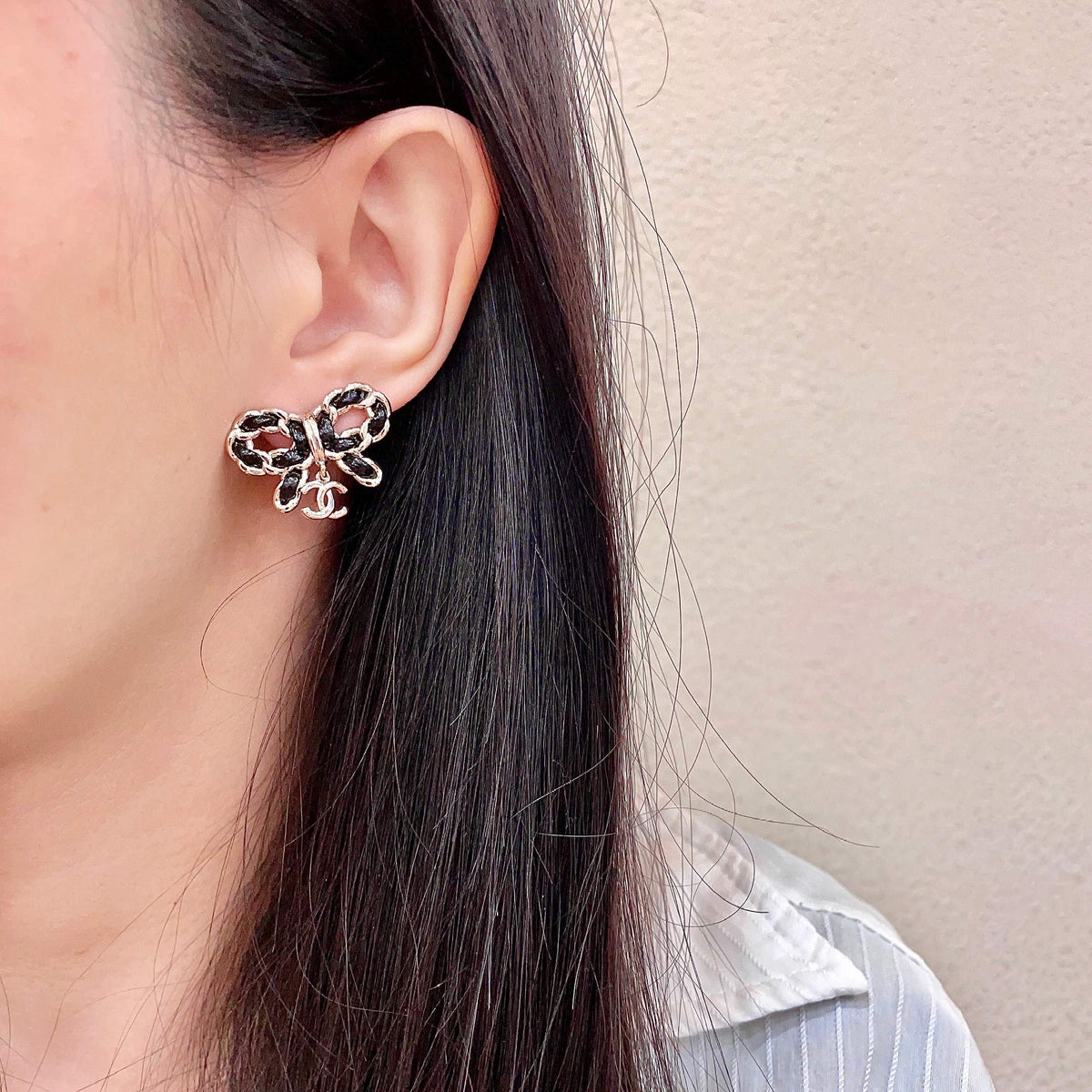 Martin Graham stud earrings in polished metal-tone – detail view