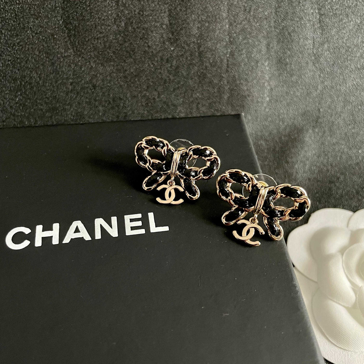 Martin Graham stud earrings in polished metal-tone – detail view