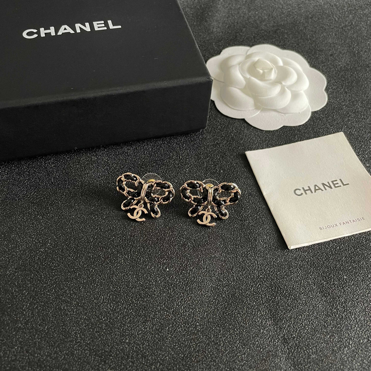 Martin Graham stud earrings in polished metal-tone – styled product view