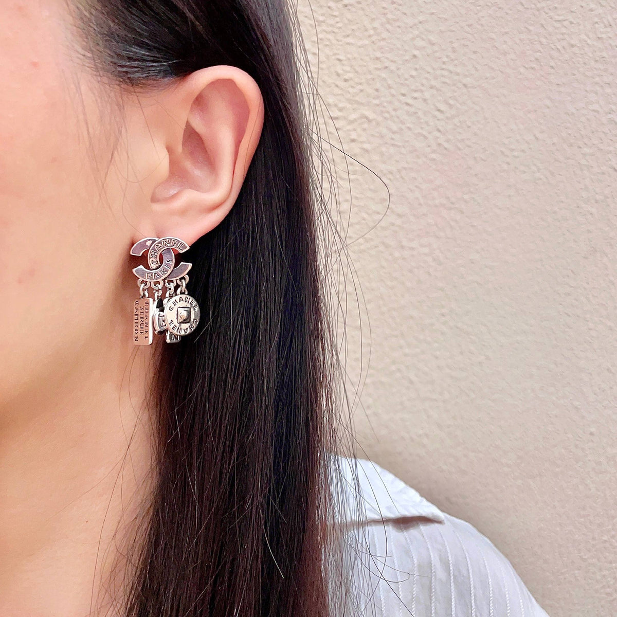 Martin Graham stud earrings in polished metal-tone – detail view