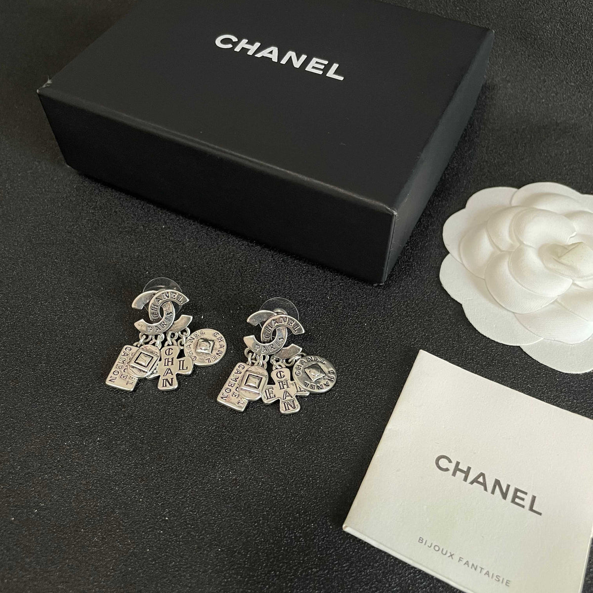 Martin Graham stud earrings in polished metal-tone – close-up detail