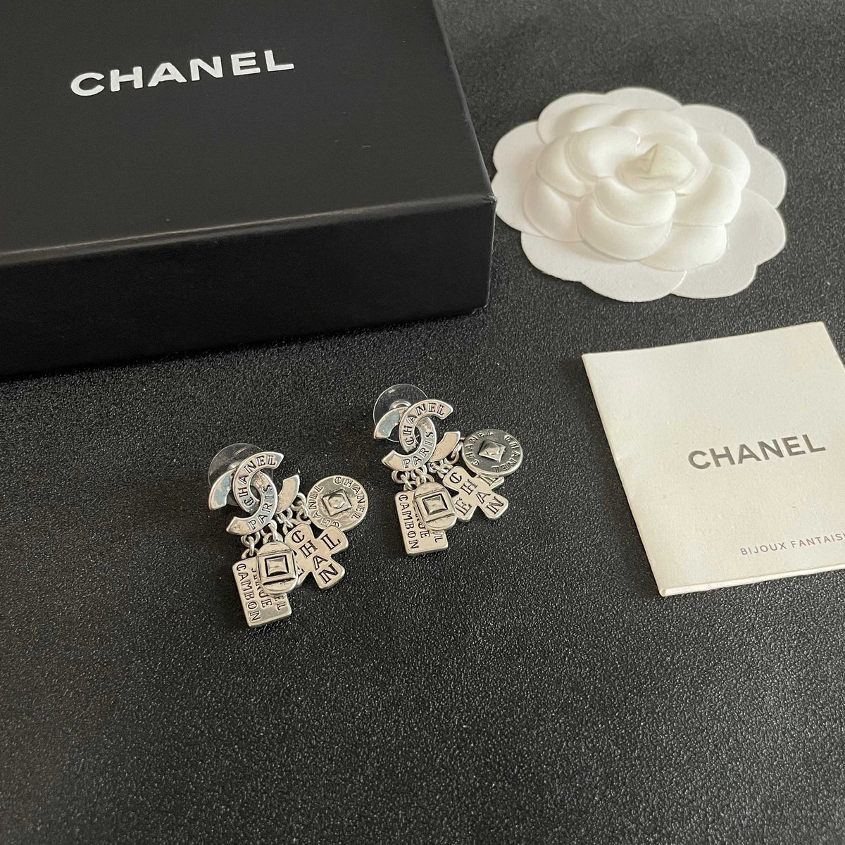 Martin Graham stud earrings in polished metal-tone – styled product view