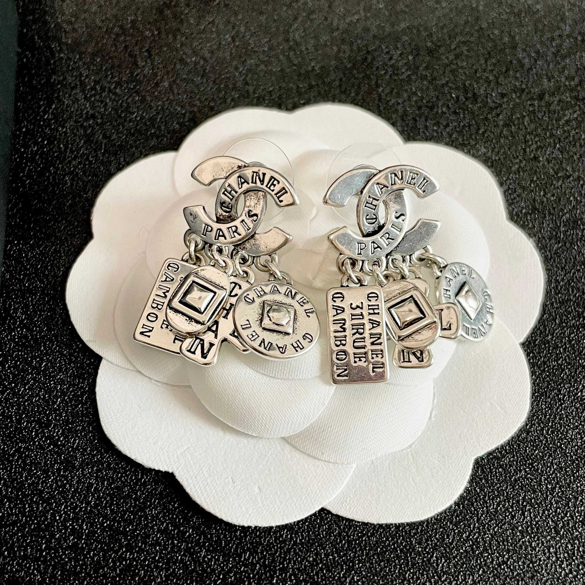 Martin Graham stud earrings in polished metal-tone – front product view