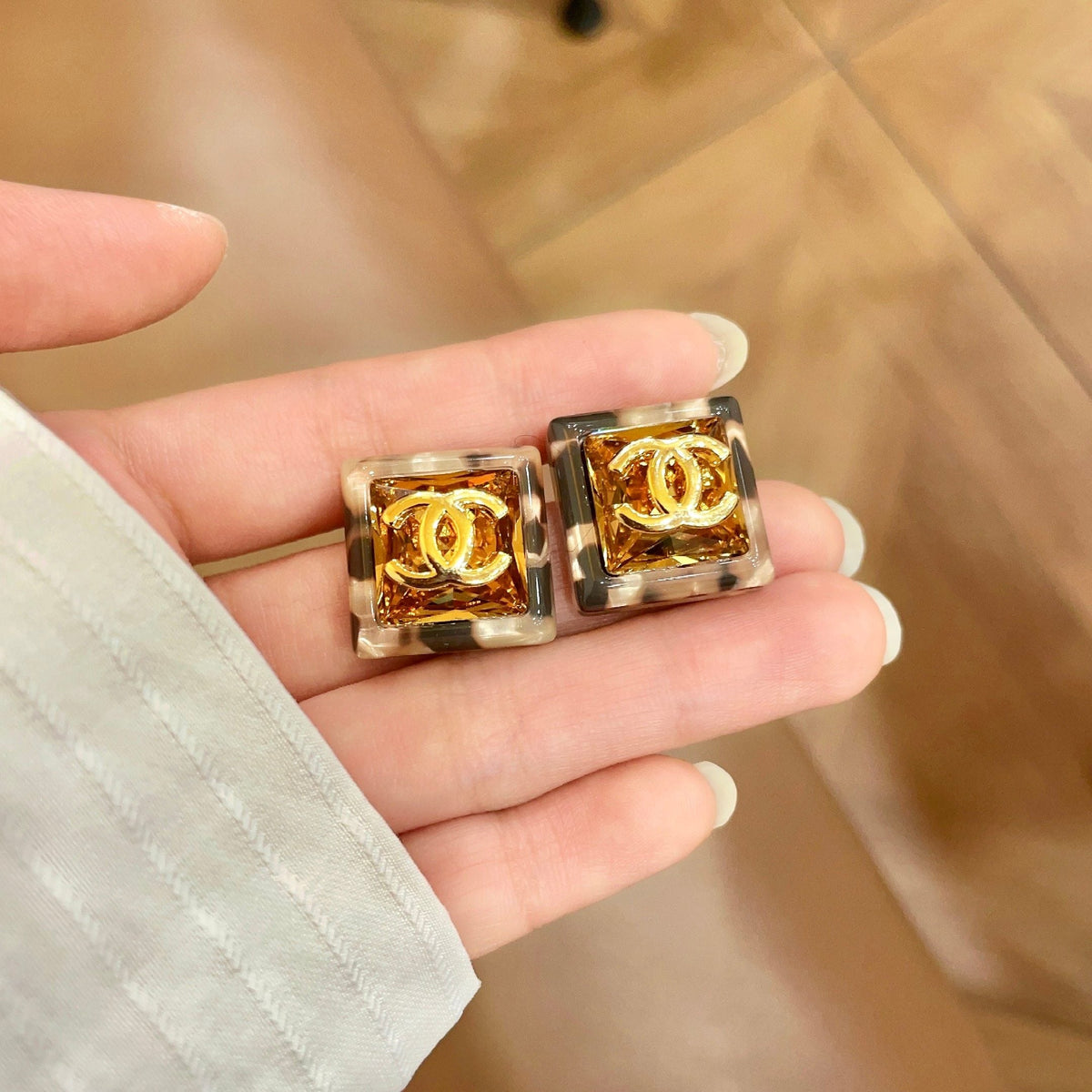 Martin Graham stud earrings in polished metal-tone – side detail