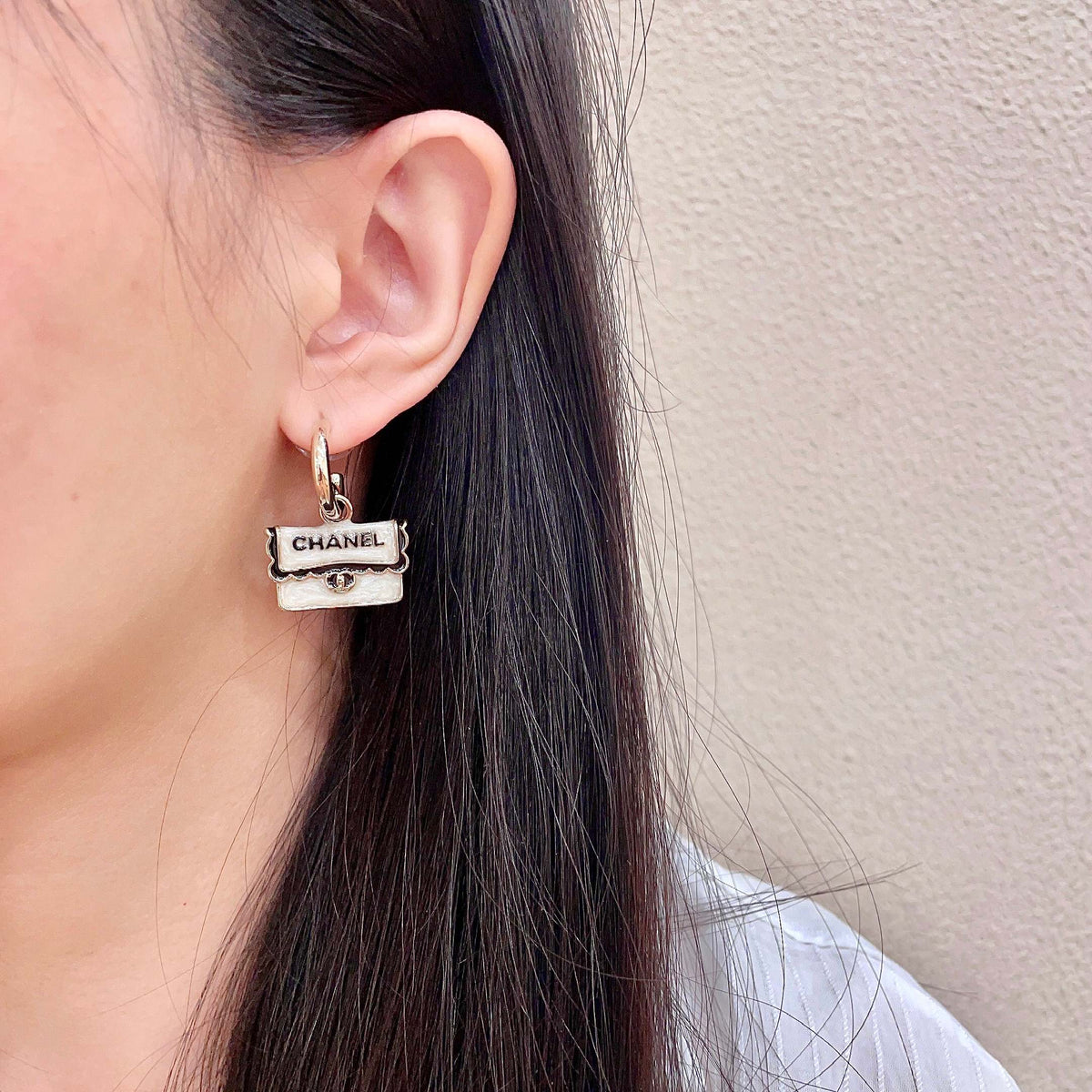 Martin Graham stud earrings in polished metal-tone – detail view