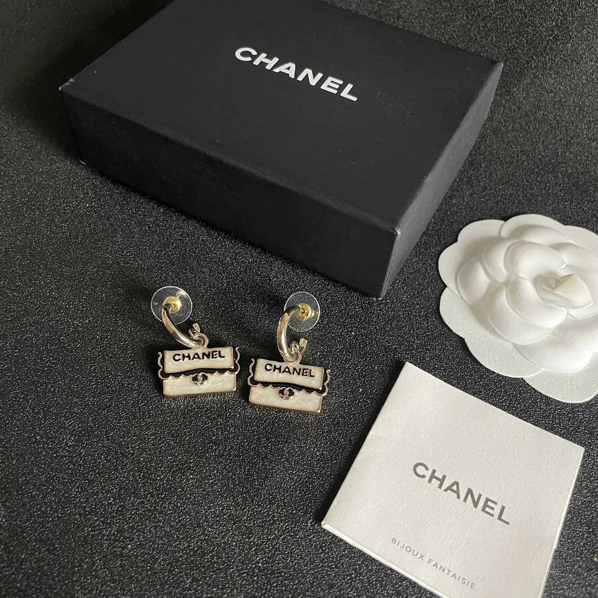 Martin Graham stud earrings in polished metal-tone – close-up detail