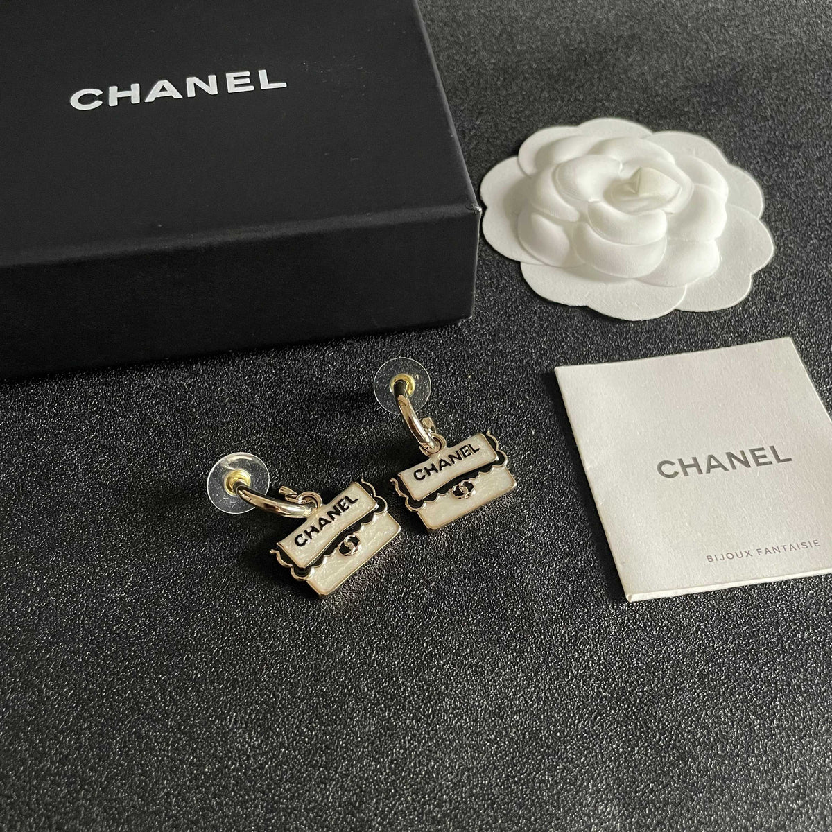 Martin Graham stud earrings in polished metal-tone – styled product view