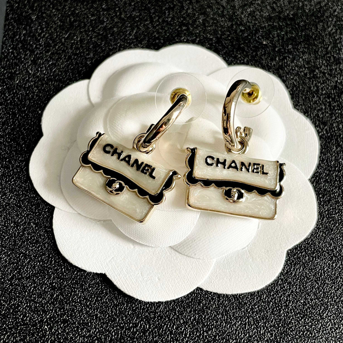Martin Graham stud earrings in polished metal-tone – front product view