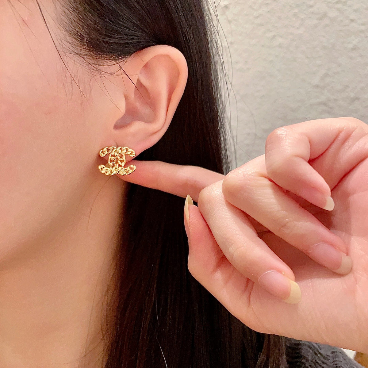 Martin Graham stud earrings in polished metal-tone – front product view