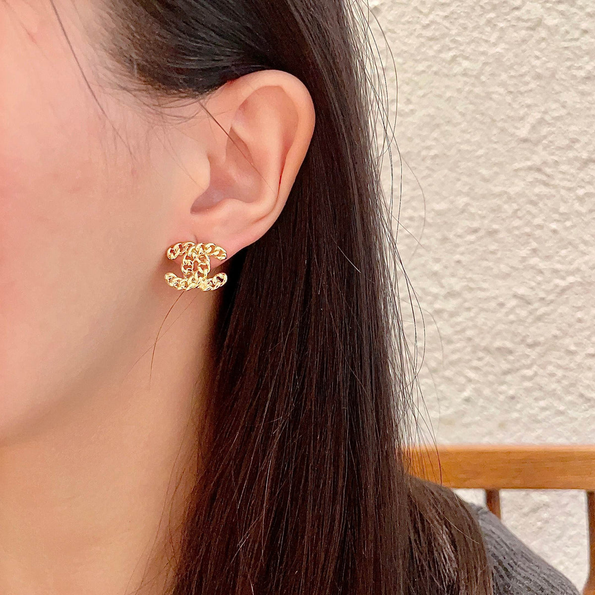 Martin Graham stud earrings in polished metal-tone – detail view