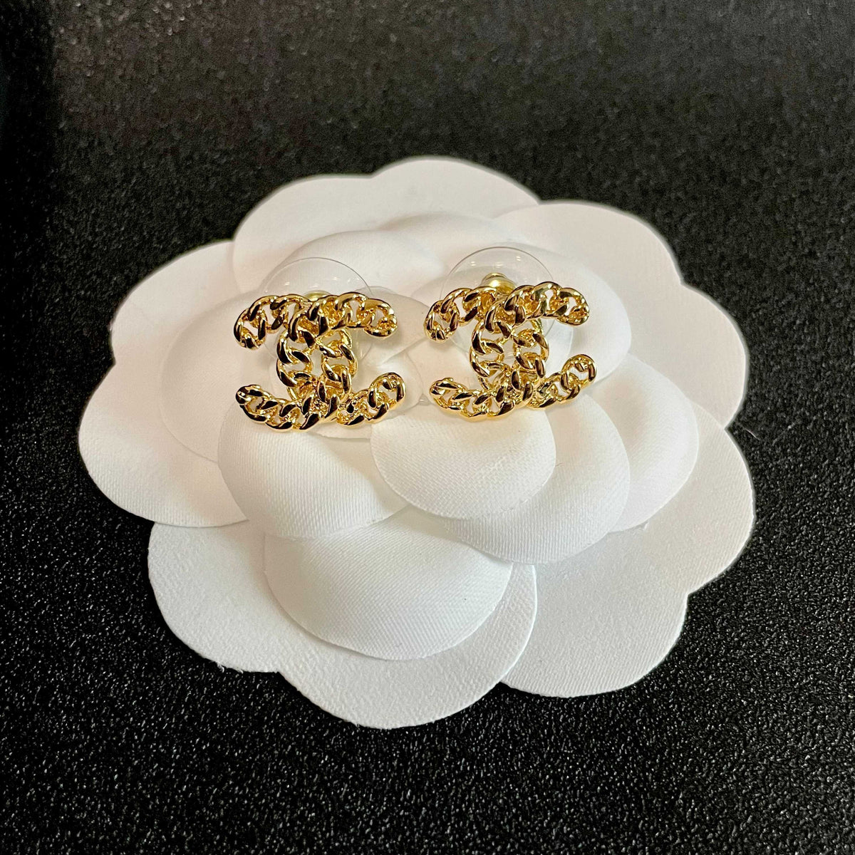 Martin Graham stud earrings in polished metal-tone – front product view