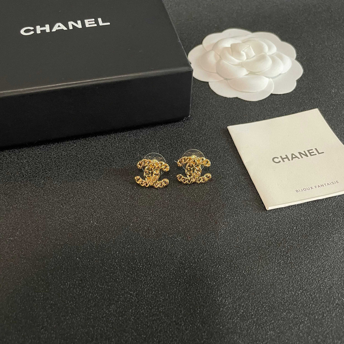 Martin Graham stud earrings in polished metal-tone – styled product view