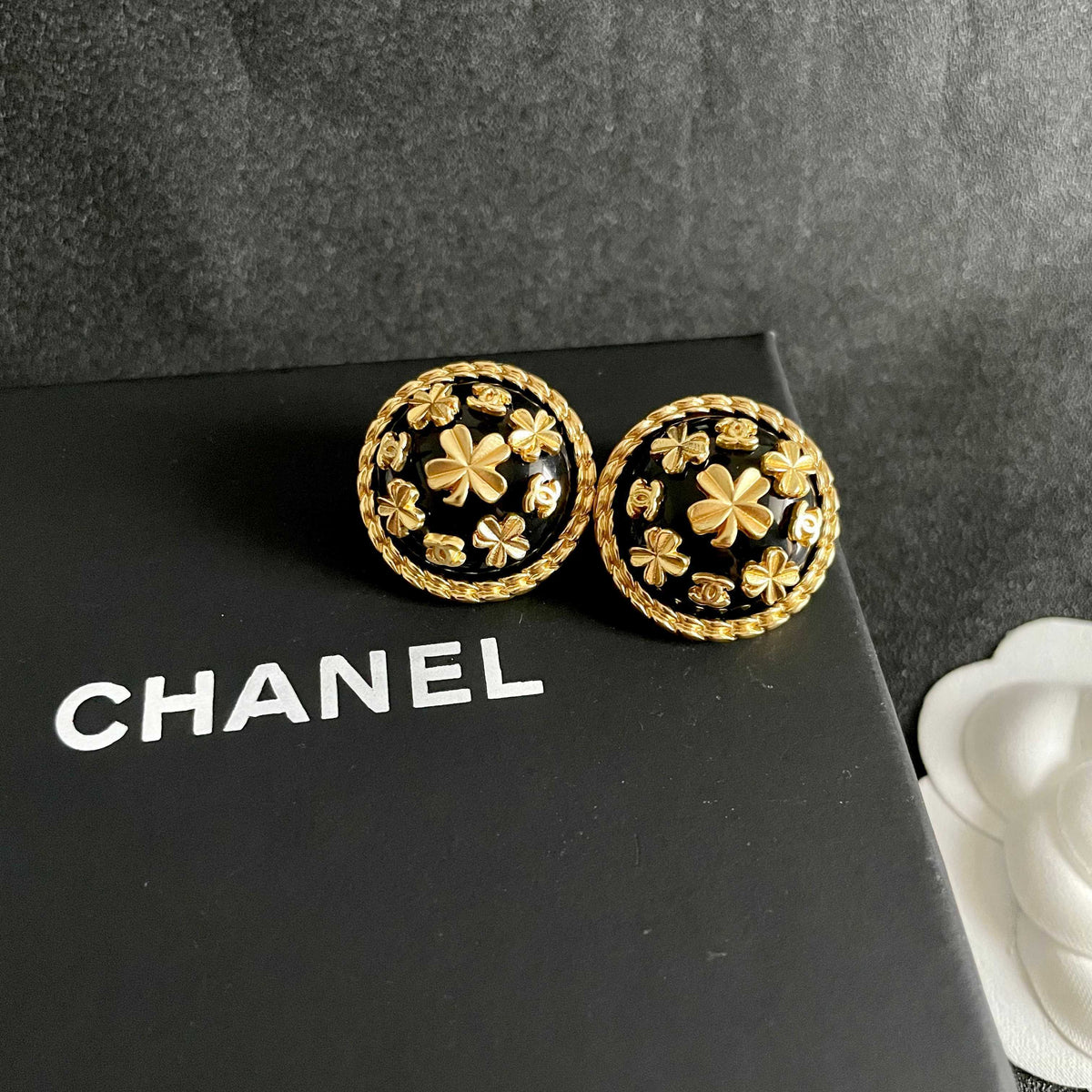 Martin Graham stud earrings in polished metal-tone – detail view