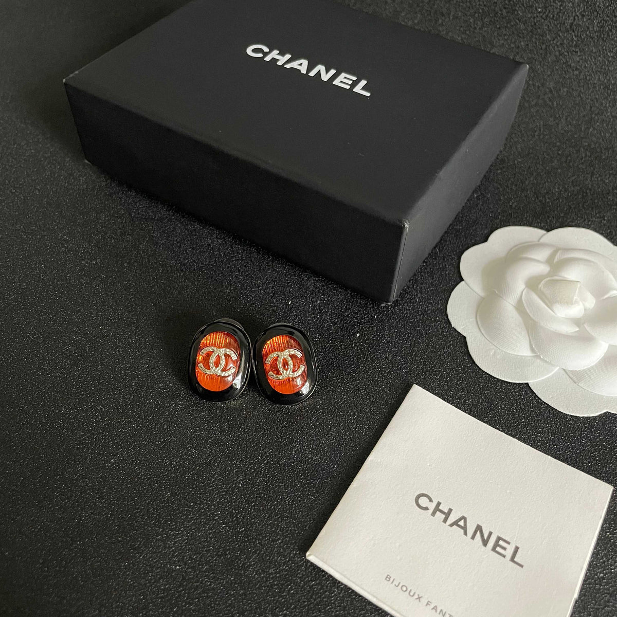 Martin Graham stud earrings in polished metal-tone – close-up detail