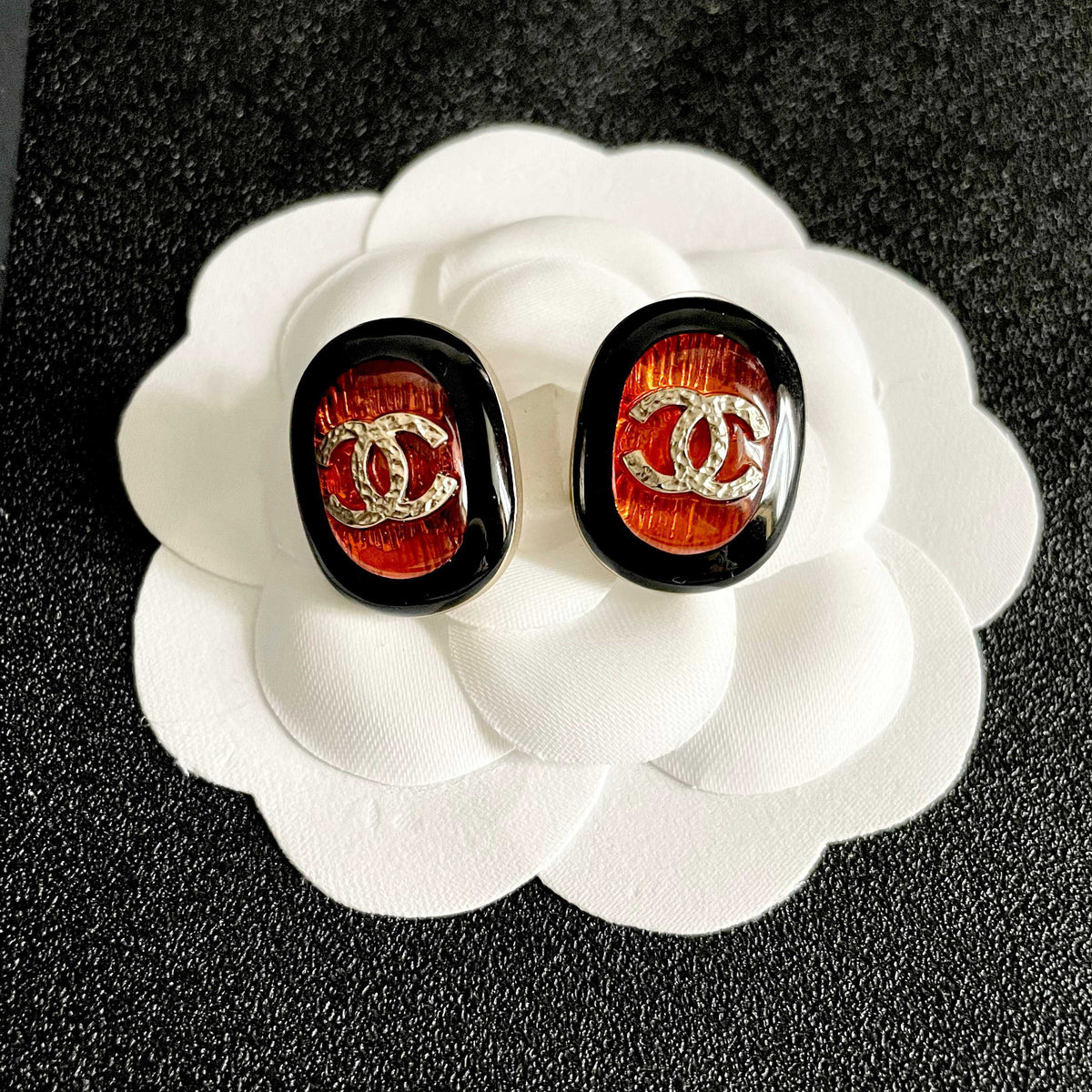 Martin Graham stud earrings in polished metal-tone – front product view