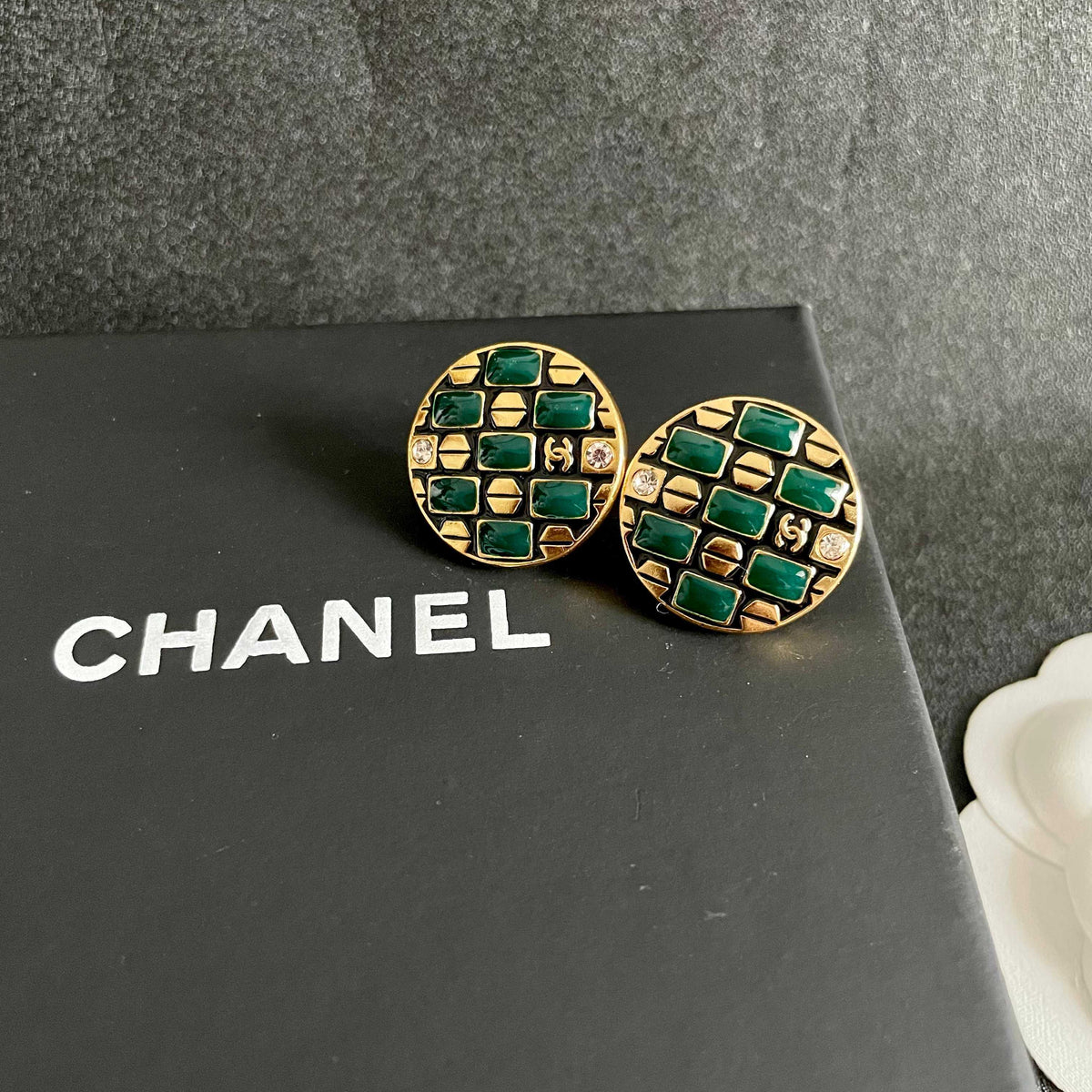 Martin Graham stud earrings in polished metal-tone – detail view