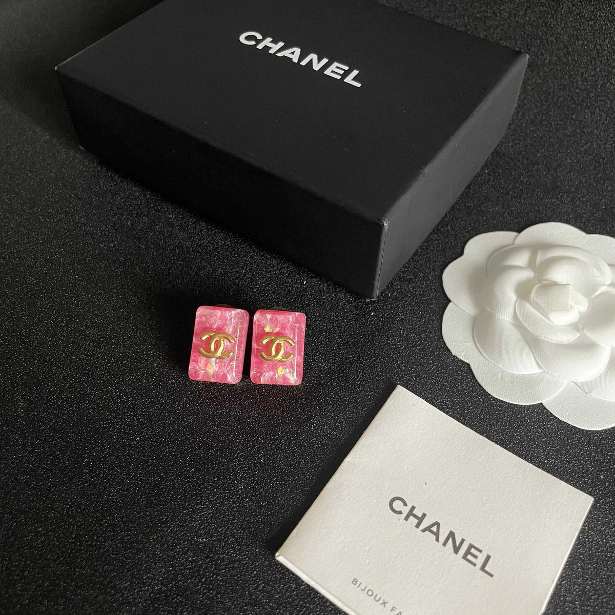 Martin Graham stud earrings in polished metal-tone – close-up detail