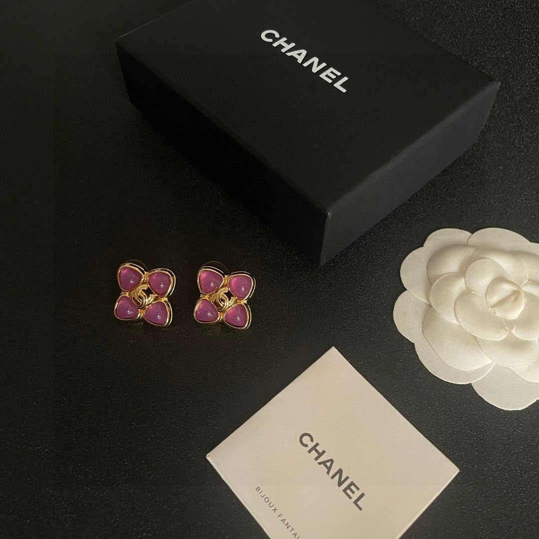 Martin Graham stud earrings in polished metal-tone – close-up detail