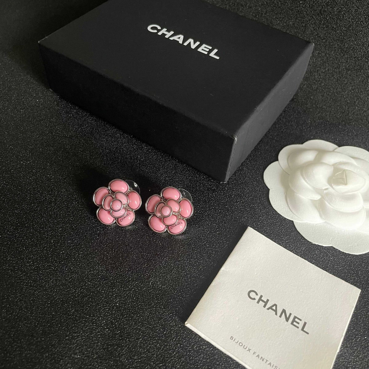 Martin Graham stud earrings in polished metal-tone – close-up detail