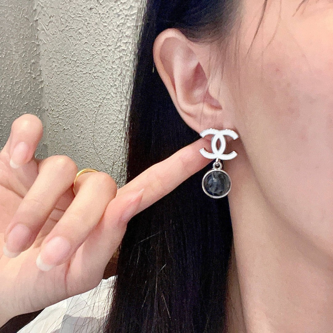 Martin Graham earrings in polished metal-tone – front product view