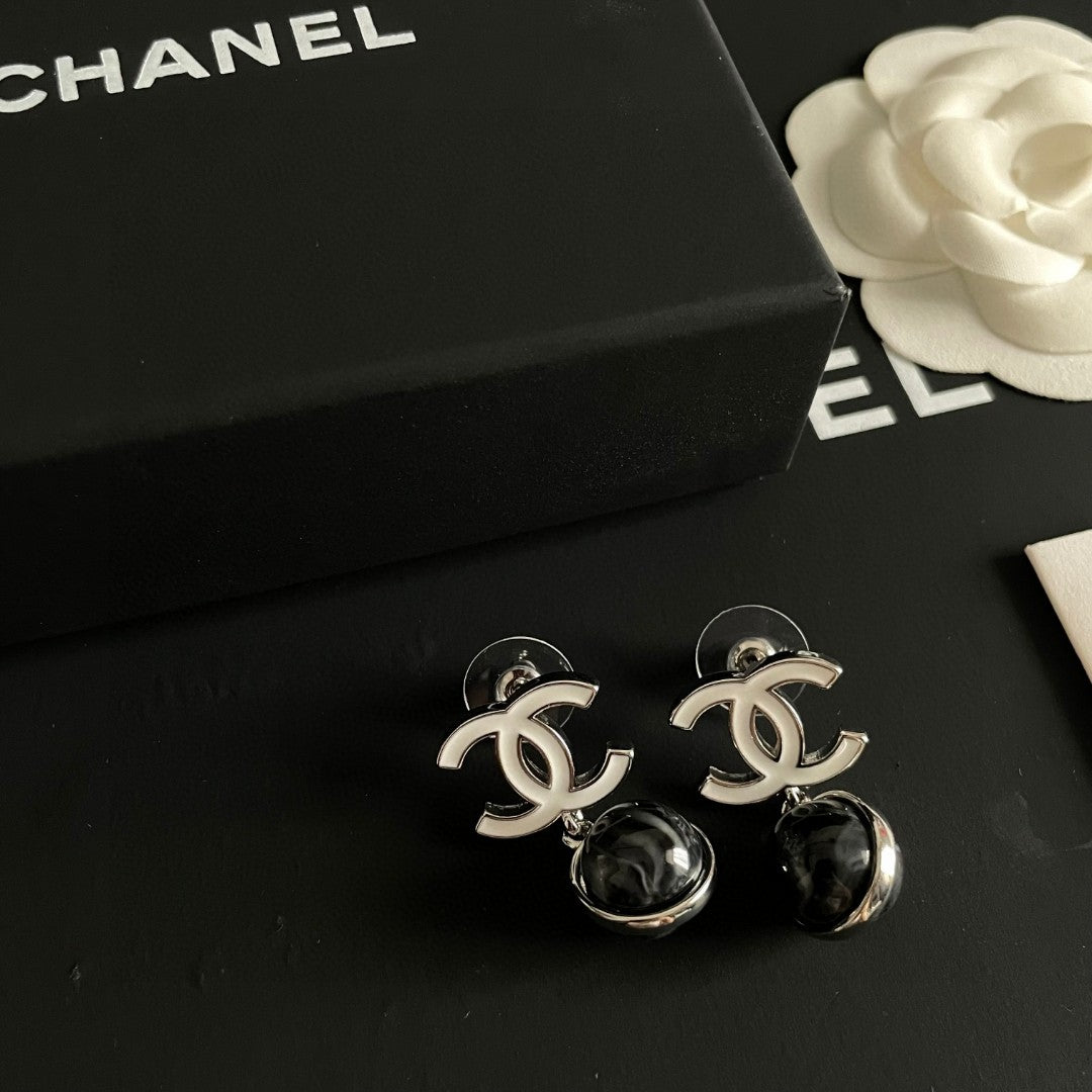Martin Graham earrings in polished metal-tone – front product view