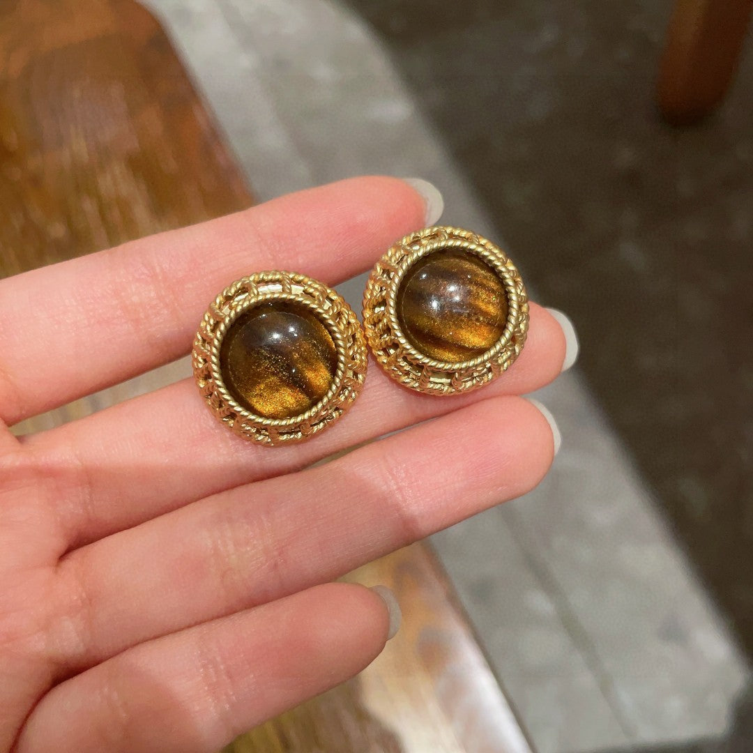 Martin Graham stud earrings in polished metal-tone – side detail