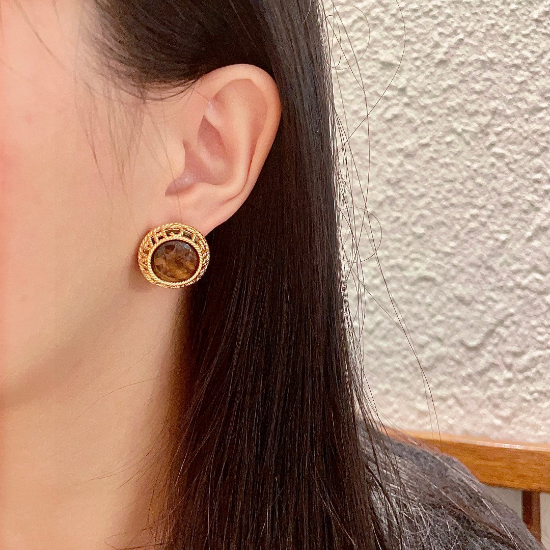 Martin Graham stud earrings in polished metal-tone – detail view